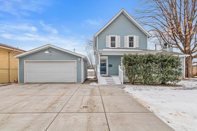 front of property with a garage, an outbuilding, and covered porch