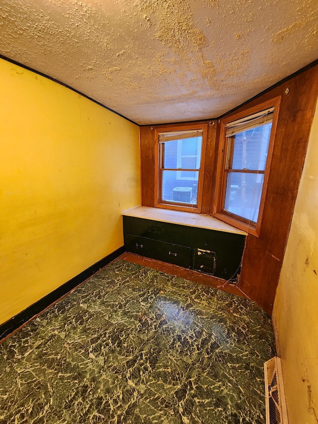 empty room featuring a textured ceiling