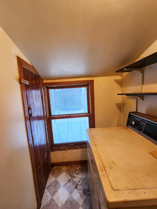 interior space with washer / clothes dryer and lofted ceiling