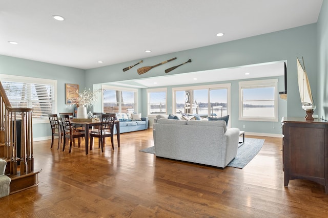 living room with recessed lighting, plenty of natural light, and wood finished floors