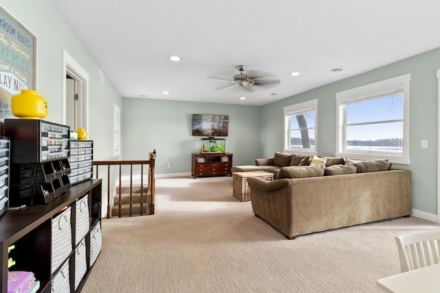 living room featuring recessed lighting, baseboards, ceiling fan, and carpet flooring