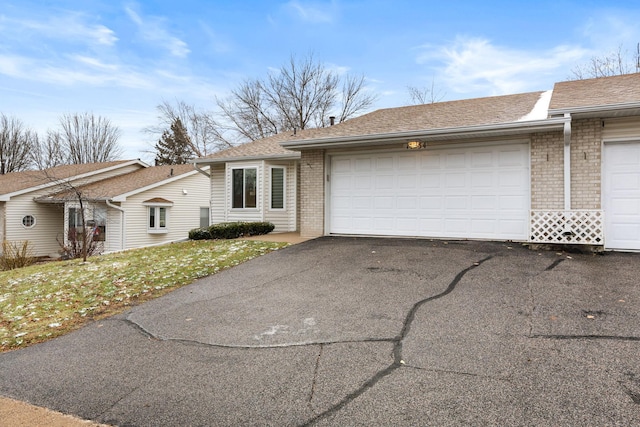 ranch-style home featuring a garage