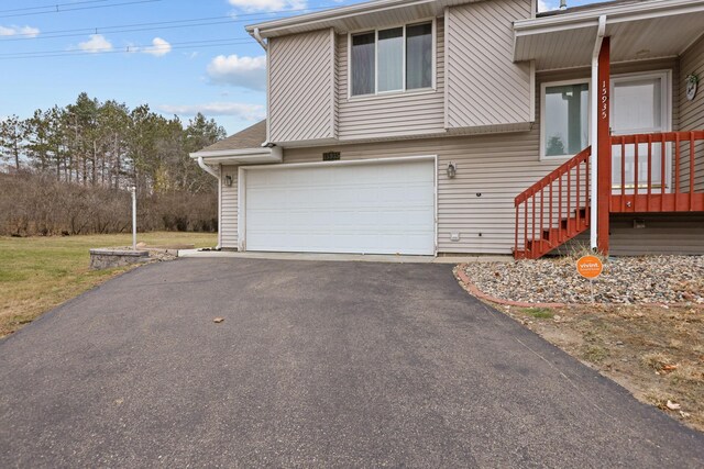 view of side of home with a garage