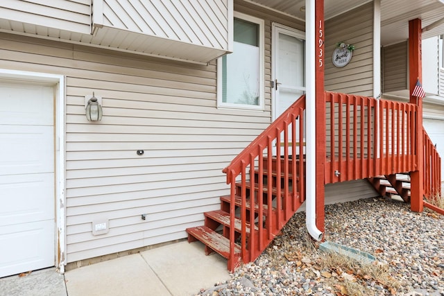 doorway to property with a garage