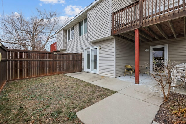 view of yard with a patio area and a wooden deck