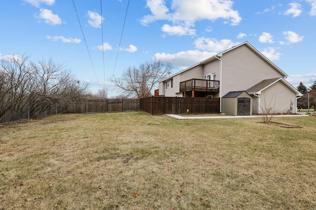 view of yard featuring a shed and a deck