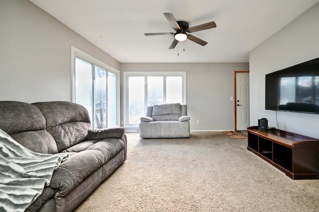 living room featuring carpet flooring and ceiling fan