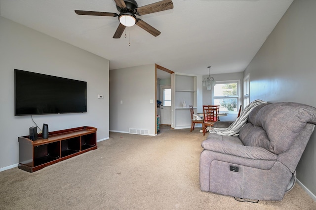 living room with carpet and ceiling fan