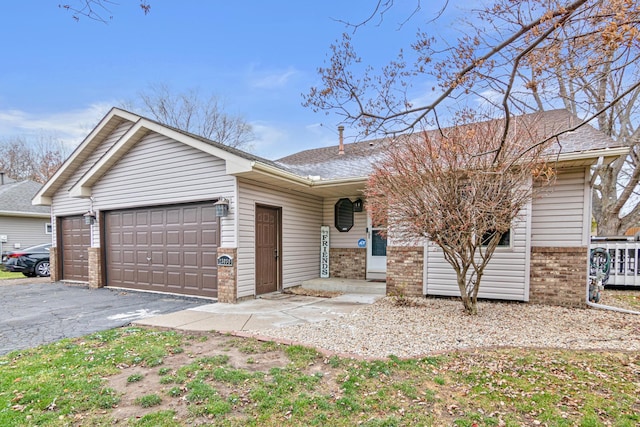 ranch-style home with a garage