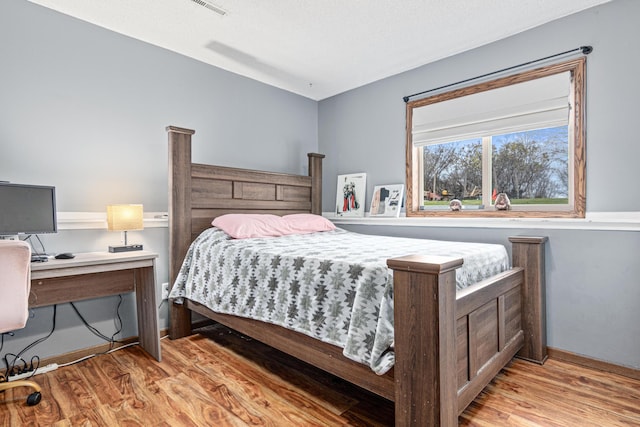 bedroom featuring light hardwood / wood-style floors