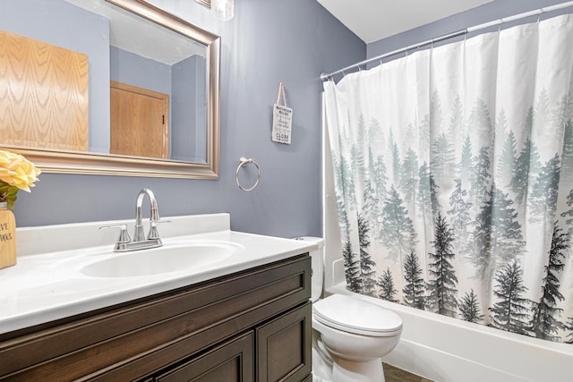 bathroom with a shower with curtain, vanity, and toilet