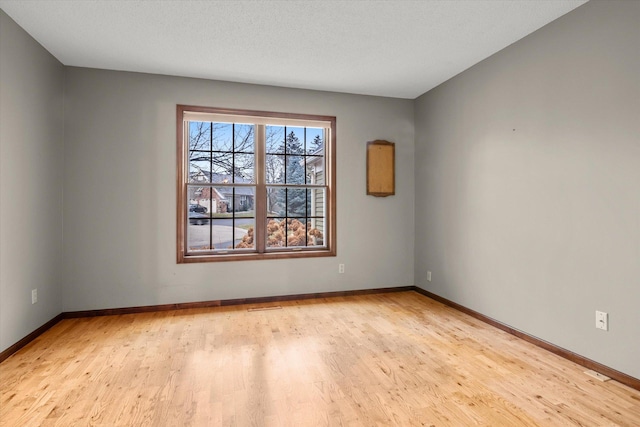 unfurnished room featuring light wood-type flooring