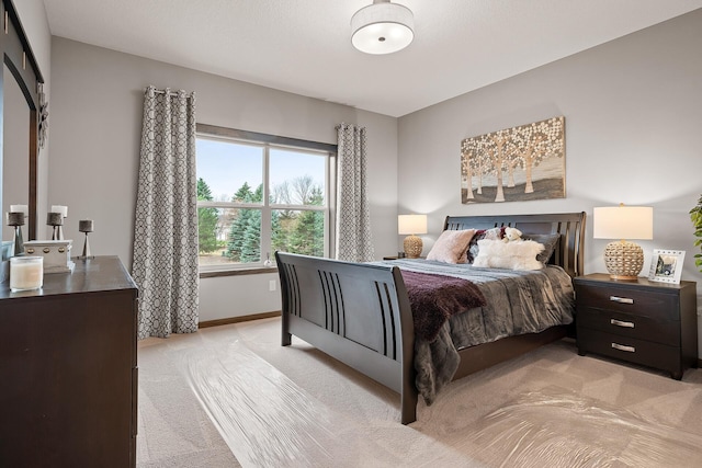 bedroom with light colored carpet