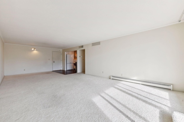 carpeted empty room with baseboard heating