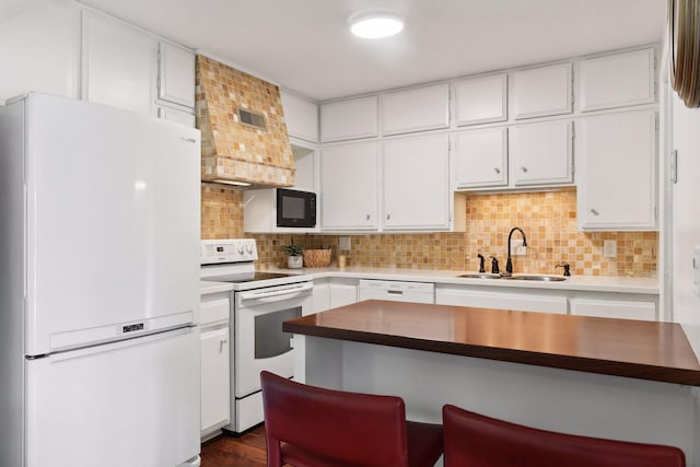 kitchen with white cabinets, white appliances, backsplash, and sink