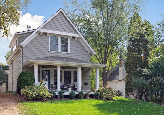 view of front of house with a front lawn and a porch