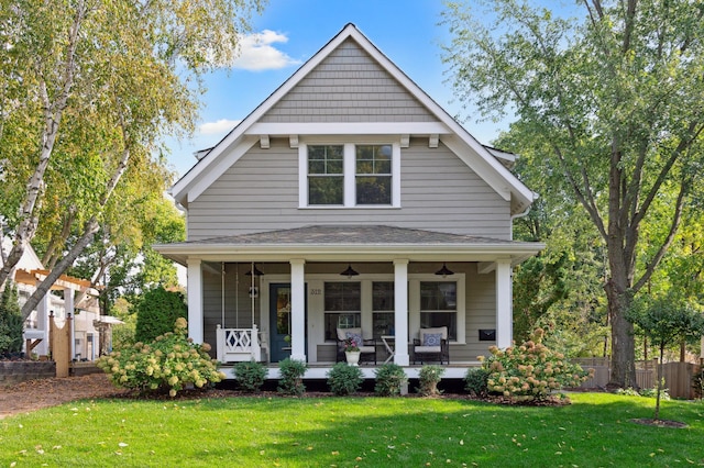 bungalow-style house with a front lawn