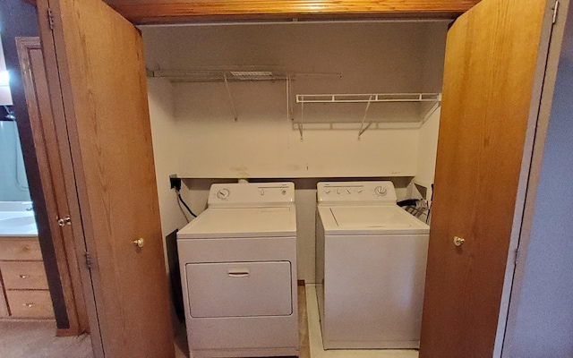 laundry room with separate washer and dryer