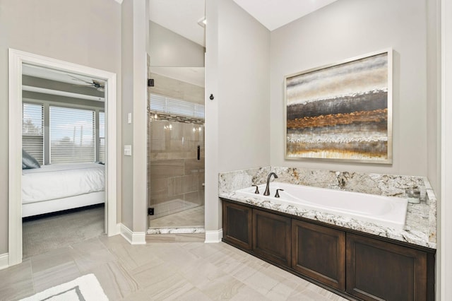 bathroom with independent shower and bath and vaulted ceiling