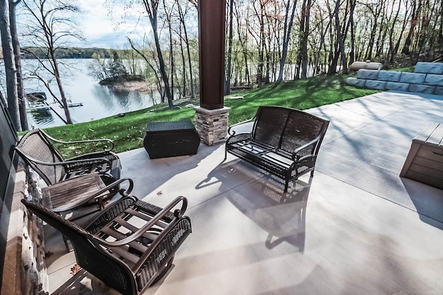 view of patio / terrace featuring a water view and an outdoor hangout area