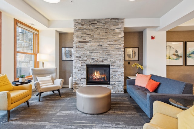 carpeted living room featuring visible vents and a fireplace