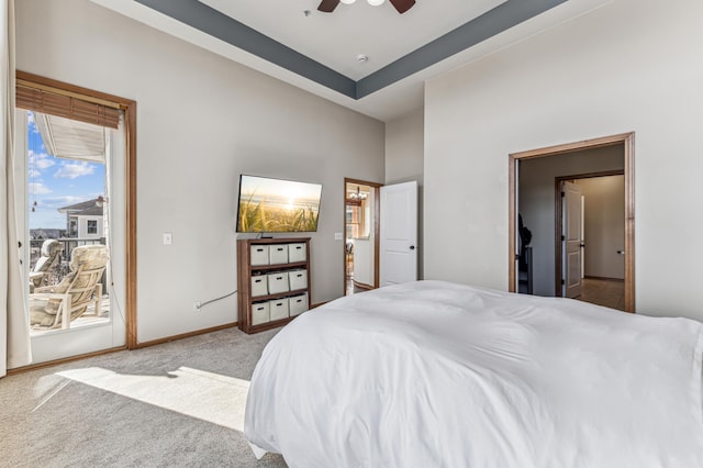 bedroom with a ceiling fan, access to outside, light carpet, and baseboards