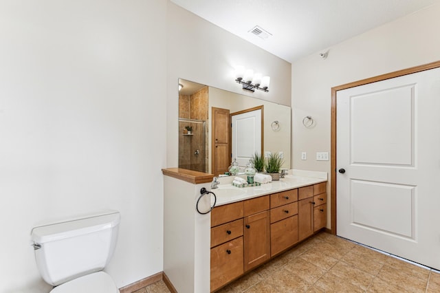 full bath featuring a stall shower, visible vents, a sink, and toilet