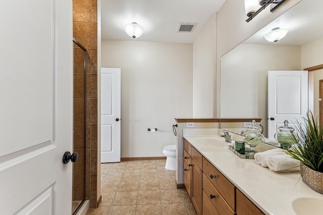 full bathroom with visible vents, a sink, tiled shower, and double vanity