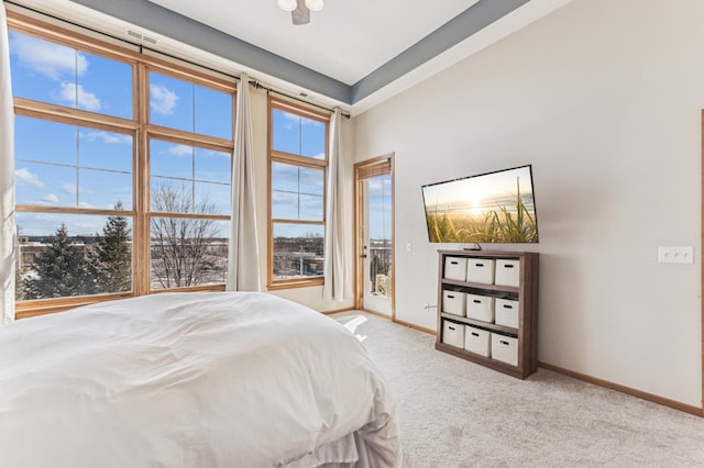 bedroom with carpet floors, access to exterior, and baseboards