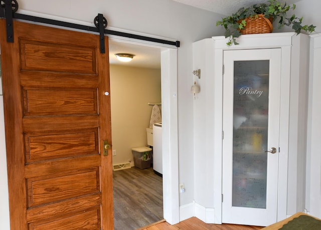 bathroom with hardwood / wood-style flooring