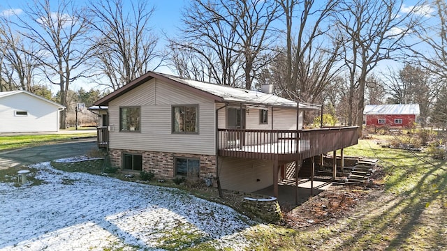 view of side of home featuring a deck