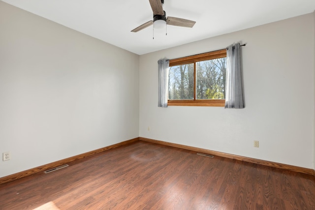 empty room with ceiling fan and wood-type flooring