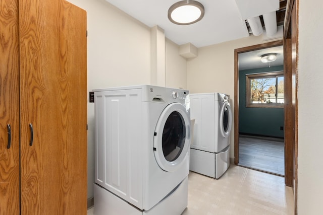 clothes washing area featuring washing machine and clothes dryer