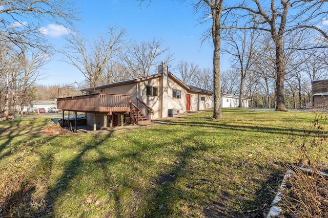 exterior space with a yard and a wooden deck