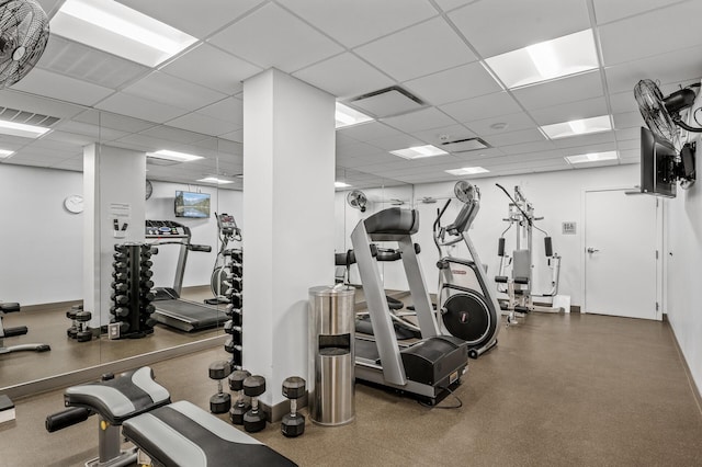 gym featuring a paneled ceiling