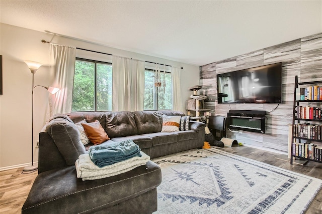 living room featuring hardwood / wood-style floors and a textured ceiling