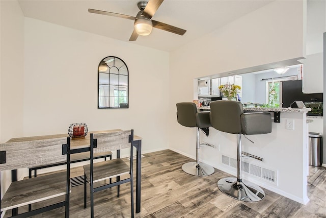 dining area featuring light hardwood / wood-style floors and ceiling fan