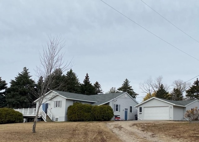 view of front of home with an outbuilding and a garage