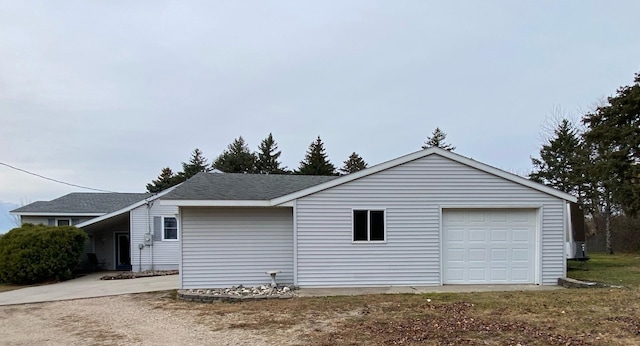 view of side of property featuring a garage