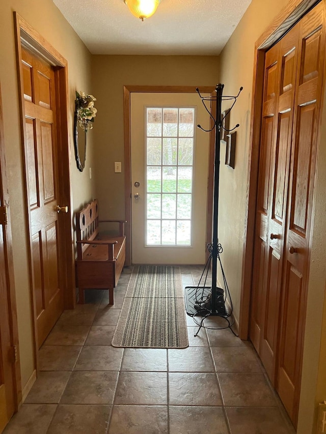 entryway with a textured ceiling