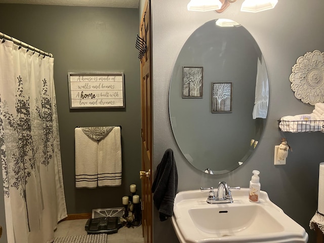 bathroom featuring tile patterned floors and sink