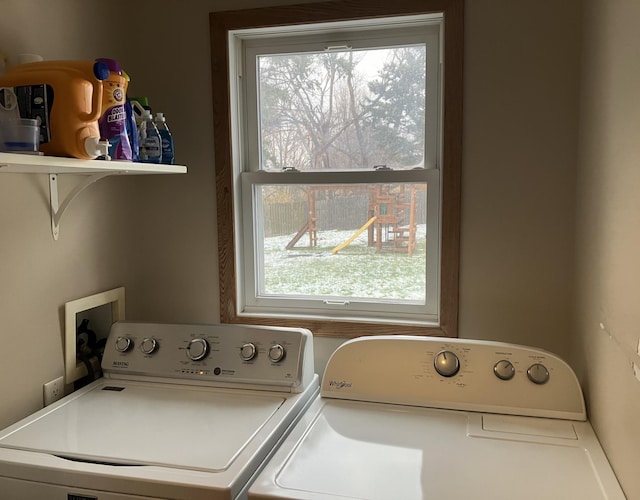 laundry area with washing machine and dryer and a wealth of natural light