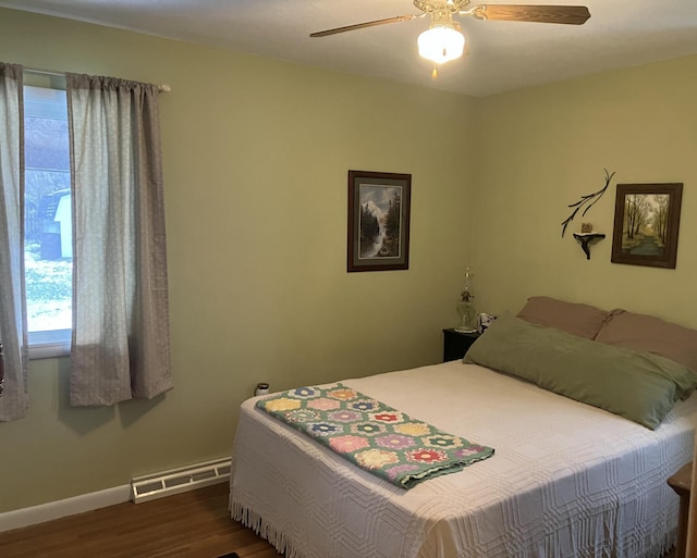 bedroom featuring dark hardwood / wood-style flooring and ceiling fan