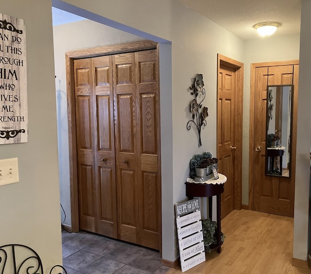 entrance foyer featuring hardwood / wood-style floors and a textured ceiling