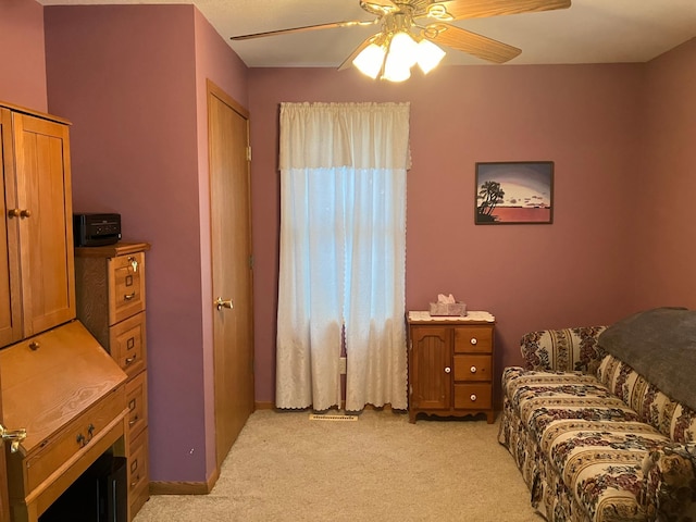 carpeted bedroom featuring ceiling fan