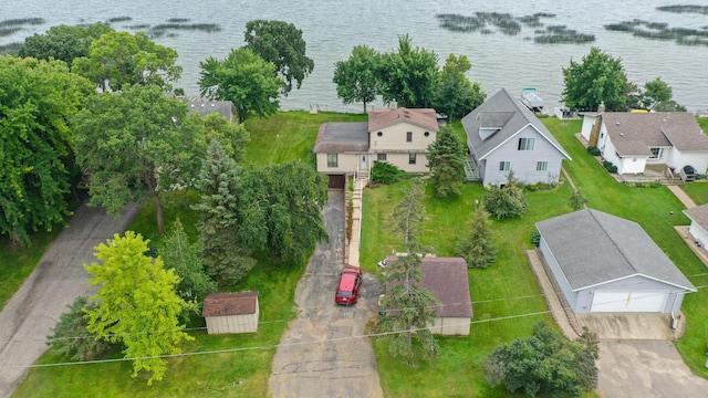 birds eye view of property with a water view