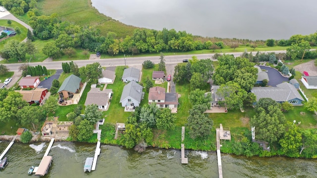 birds eye view of property featuring a residential view and a water view
