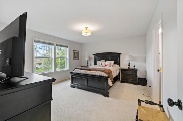 bedroom with light carpet