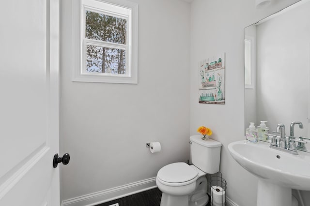 bathroom with toilet and sink