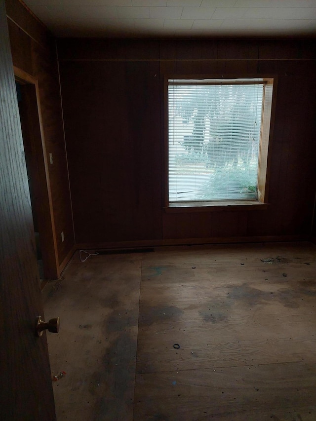 empty room with wooden walls